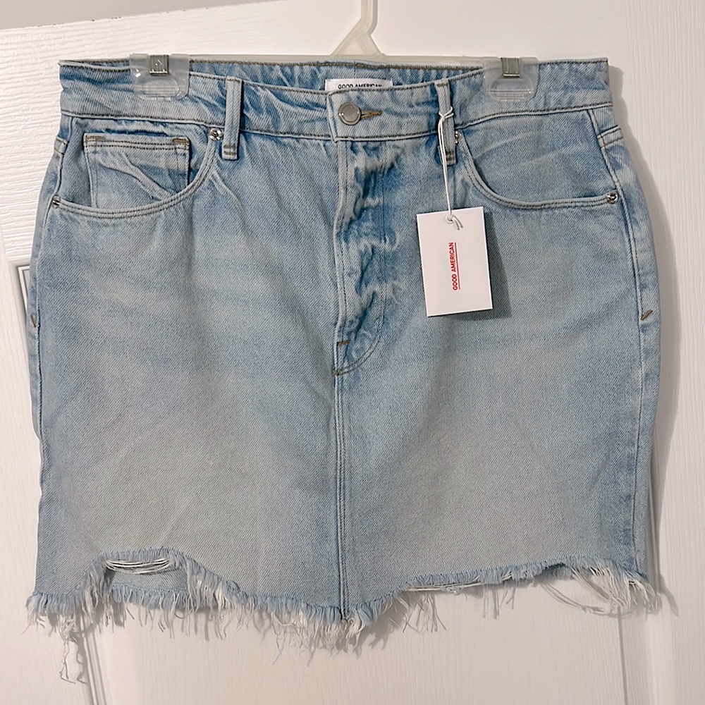Good American Light Wash Distressed Raw Hem Mini Denim Jean Skirt